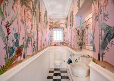 Palm Therapy is a wallpaper installed installed above the molding in a bathroom